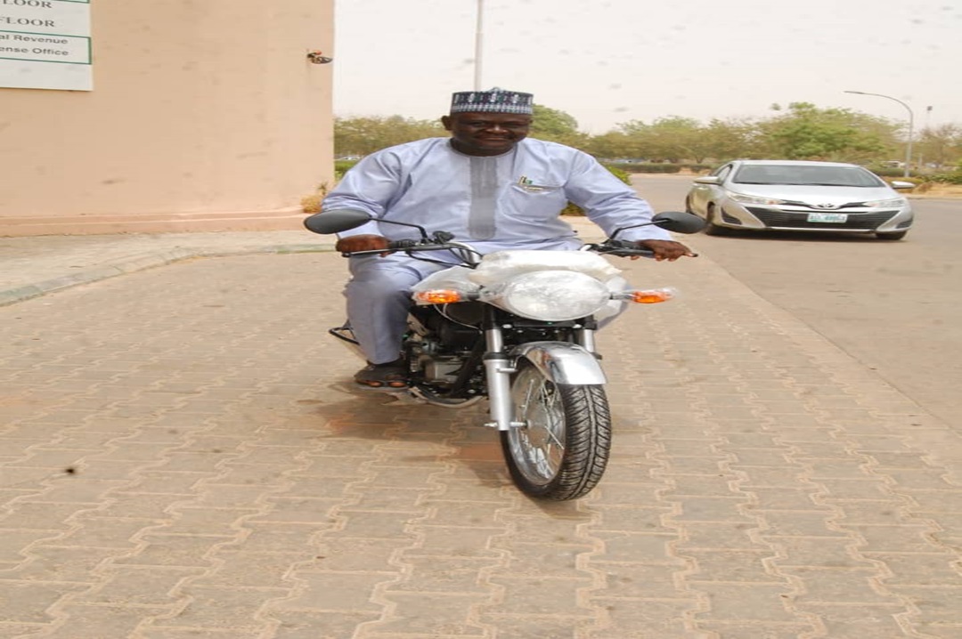 Auditor General inspecting one motorcycle